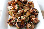 Grilled Potatoes with Garlic and Rosemary on a Charcoal Grill