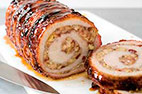 Grilled Pork Loin with Apple-Cranberry Filling on a Charcoal Grill