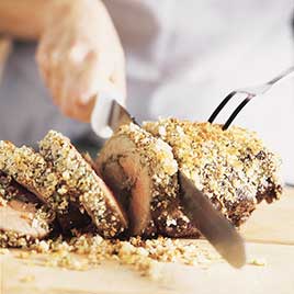 Indian-Spiced Roast Boneless Leg of Lamb with Herbed Almond-Raisin Crust